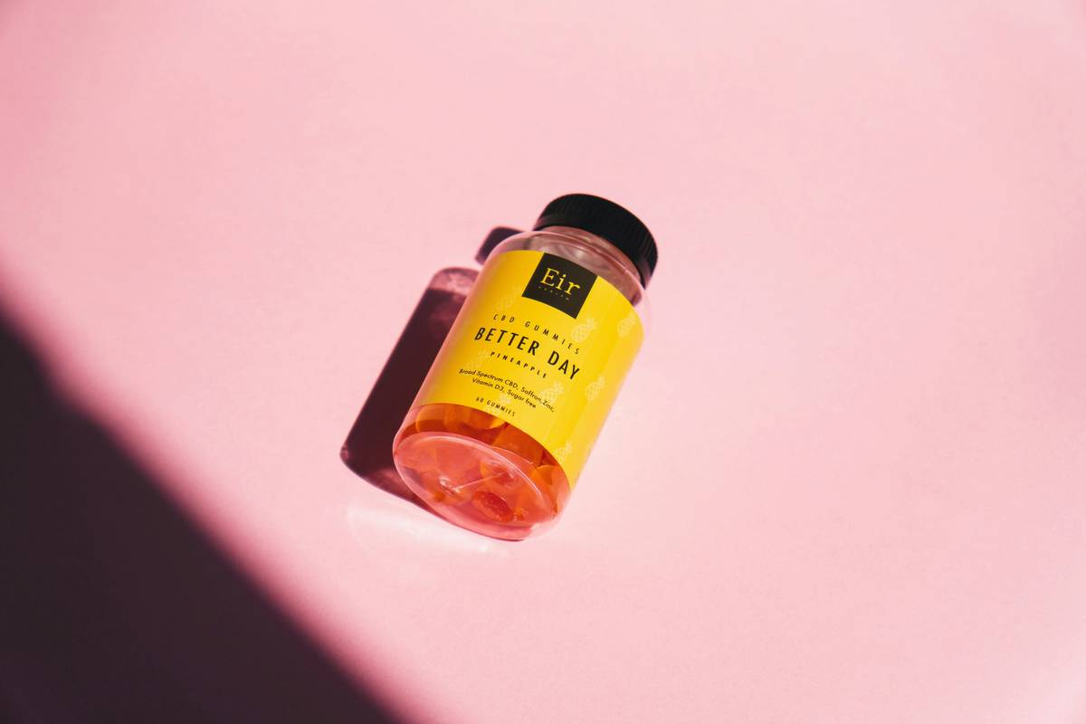 what is zinc good for - woman taking zinc supplement for glowing skin